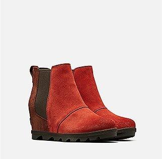  A pair of Joan Wedge Chelsea boots on a white background