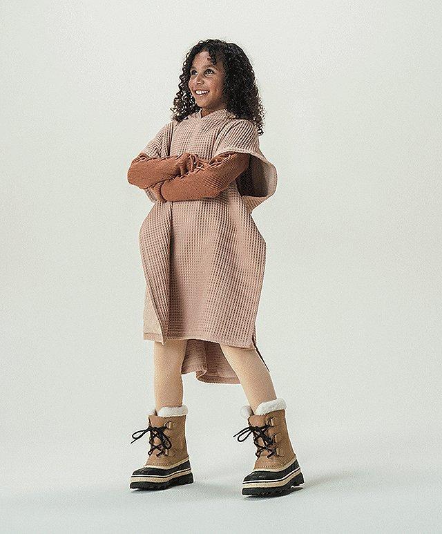 Image of child with SOREL boots on