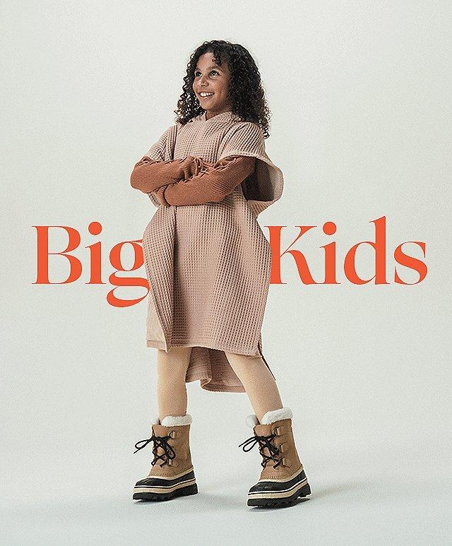 Image of child with SOREL boots on