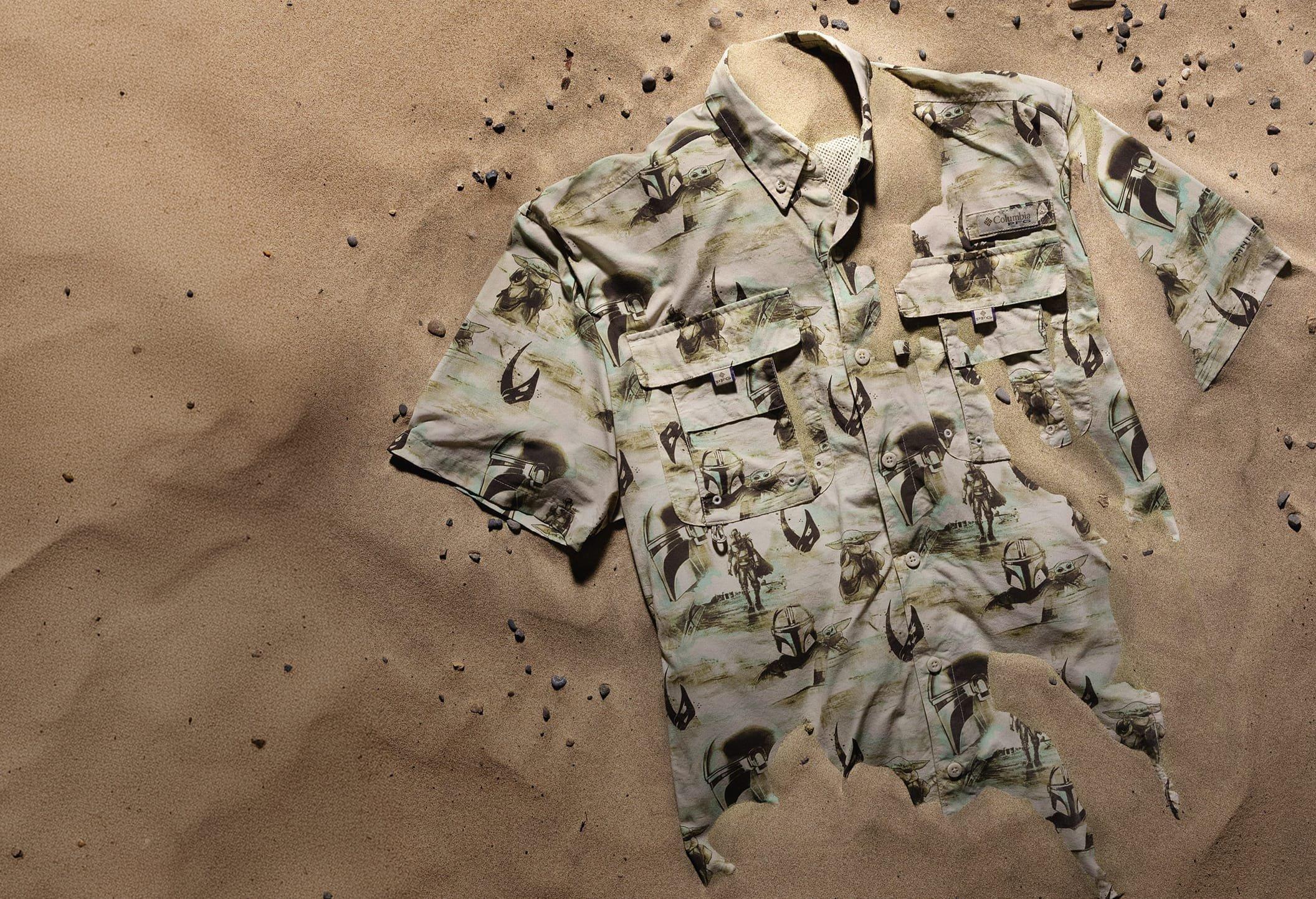 Special-edition Star Wars The Mandalorian and Grogu Bahama shirt lightly covered in desert sand.