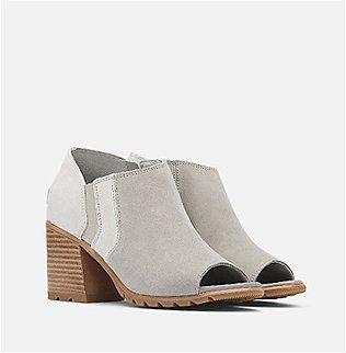 A pair of SOREL Nadia ankle booties on a white background