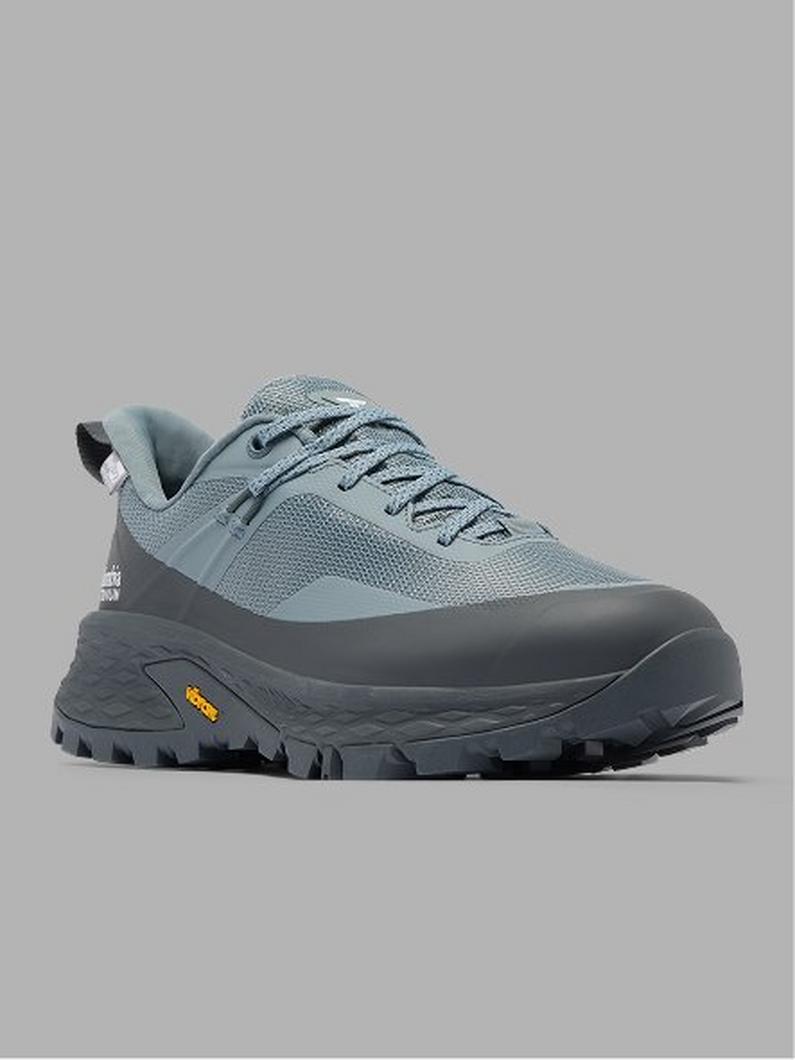 Light blue and dark gray hiking shoe with Vibram sole and aggressive tread pattern, shown from side angle.