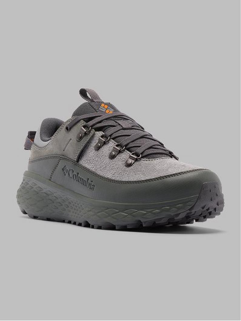Gray hiking shoe with textured sole, mixed material upper, and lace-up closure.