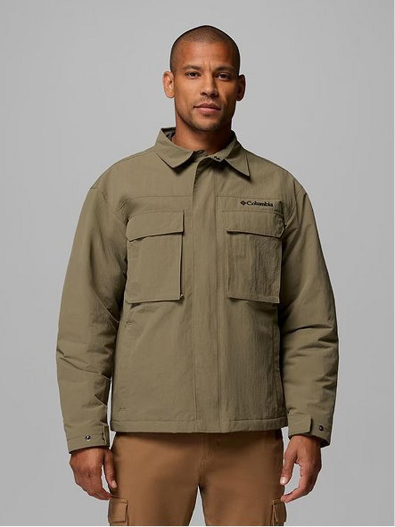 Man wearing olive green utility jacket with chest pockets and tan cargo pants.