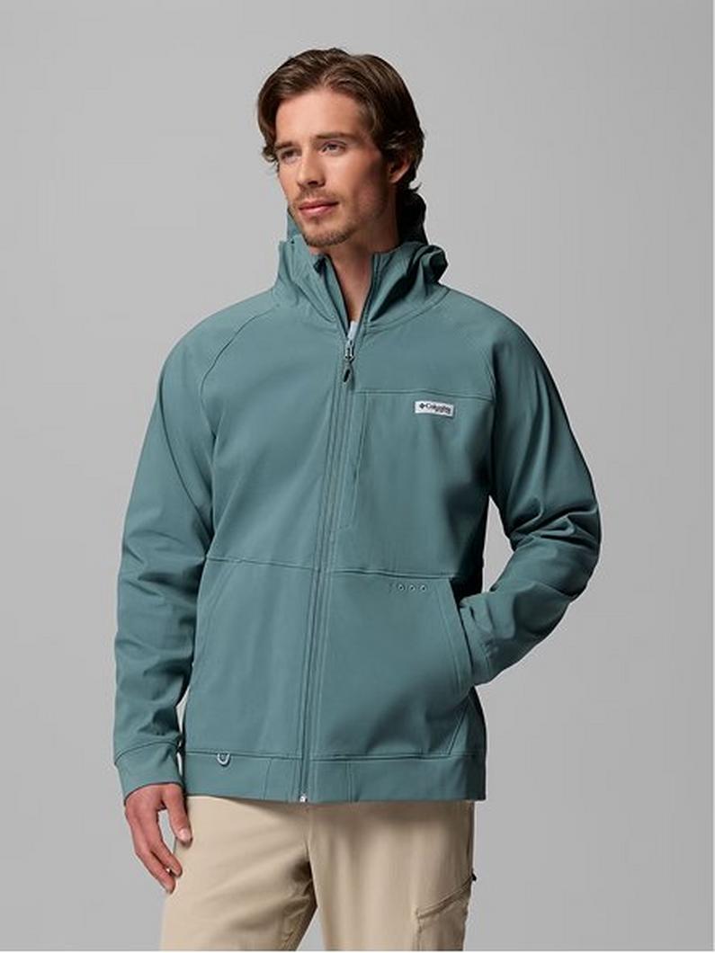 Man wearing teal full-zip jacket with high collar and khaki pants.