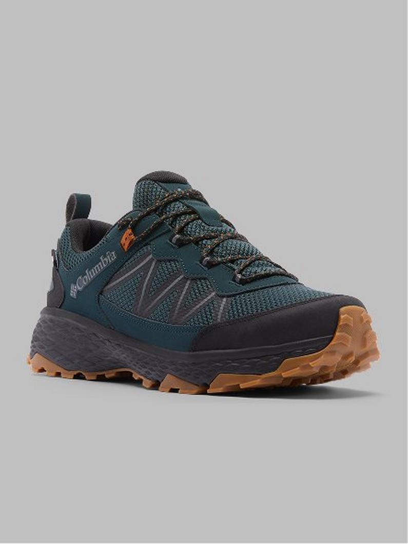 Teal and black trail running shoe with orange accents and tan rubber outsole, shown from side angle.