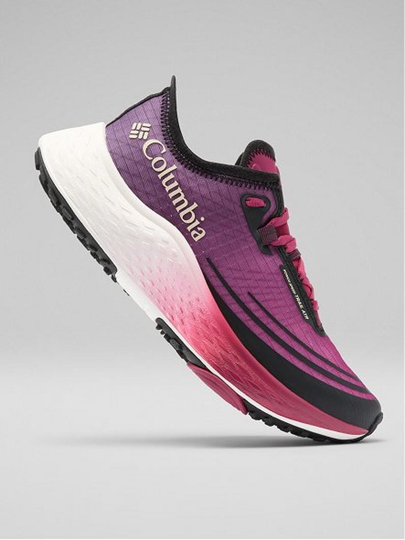 Athletic running shoe in purple and pink gradient with white midsole and black treaded outsole.