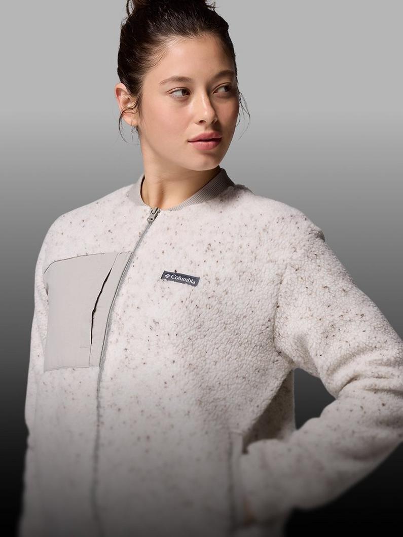 A woman wearing a beige fleece