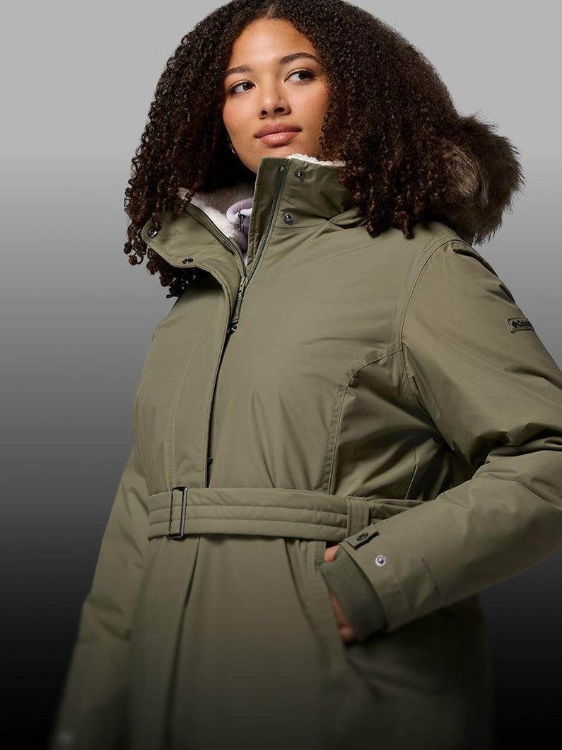 A woman wearing an olive jacket