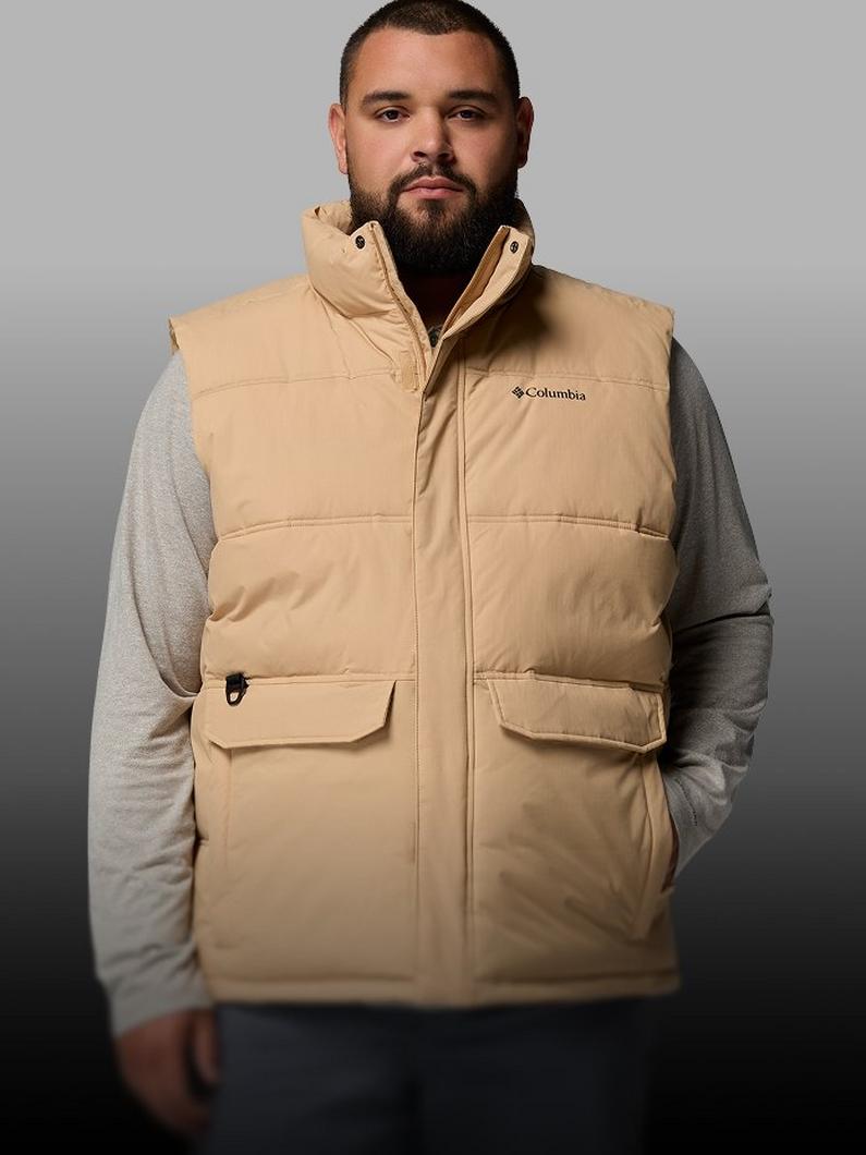 A man wearing a tan vest.