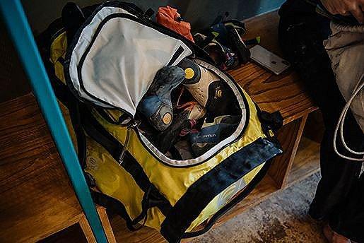 Looking into a Camp 4 duffel full of climbing equipment