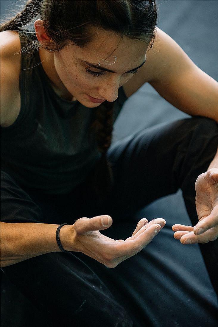 Kyra looking down at her hands