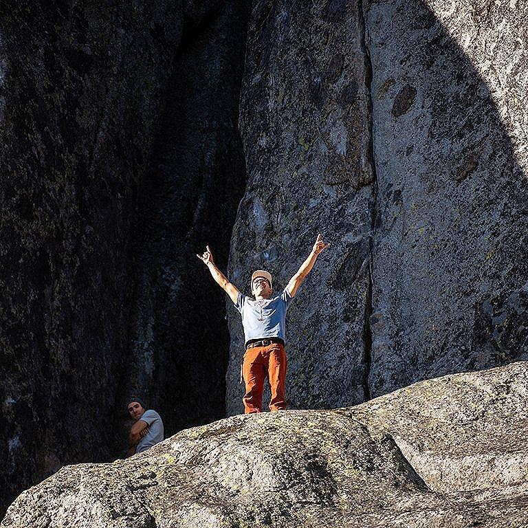 Climber doing the horns signal with his hands stoked to be at donner.
