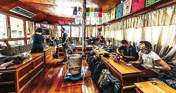 Mountain Hardwear crew takes a break from the Everest Base Camp trek in a tea house near Nimchi Valley, Nepal.