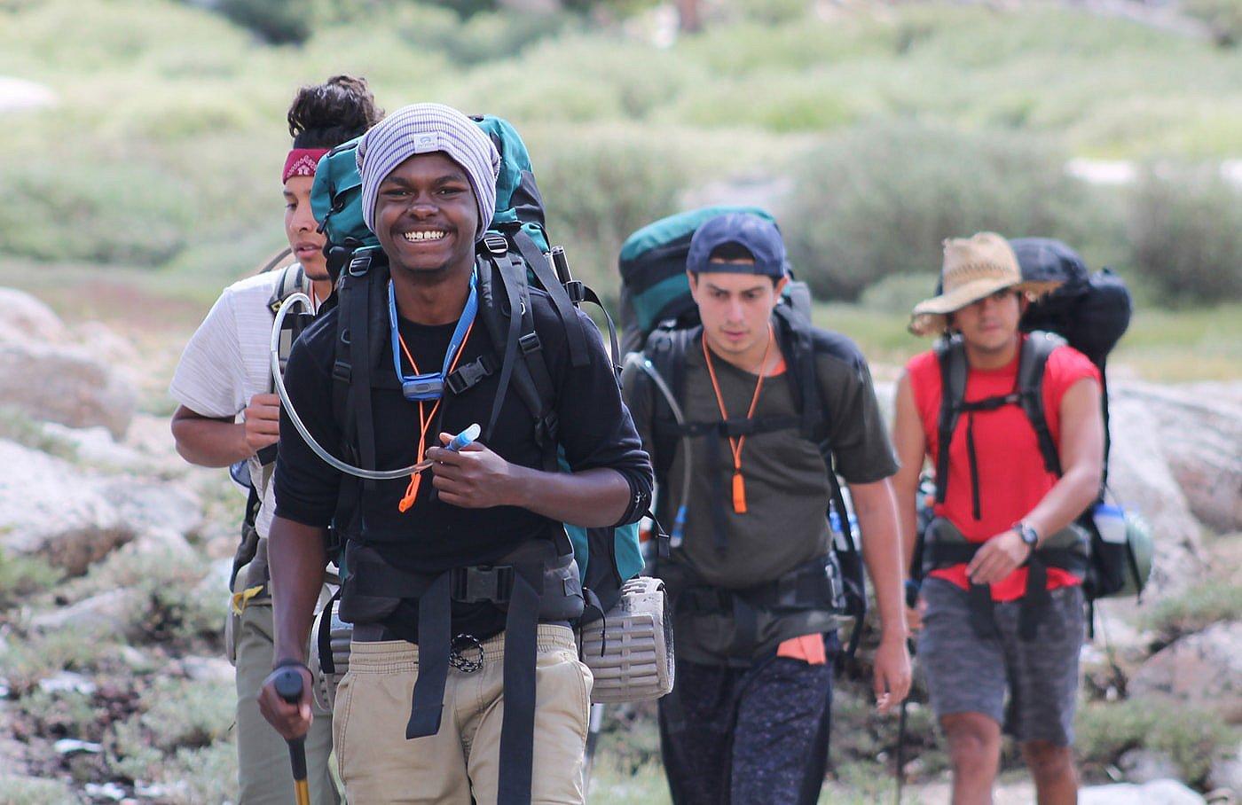 A group of Outdoor Outreach members hiking. 