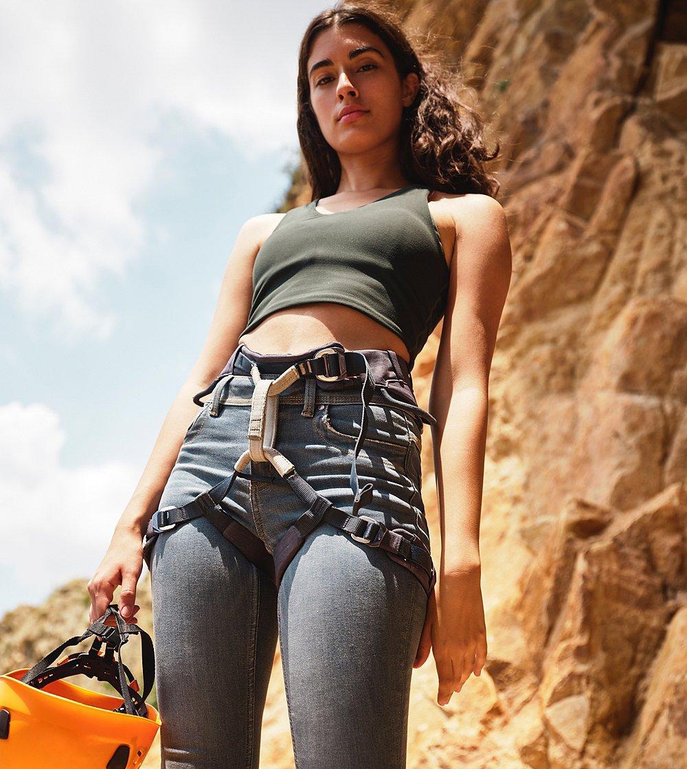 A woman in a climbing harness represent prAna's climbing collection.