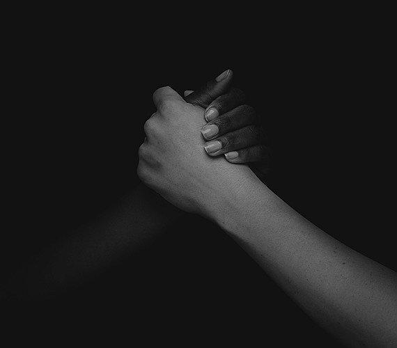 A black and white image of two hands clasping represents prAna's memberships and cause partners. 