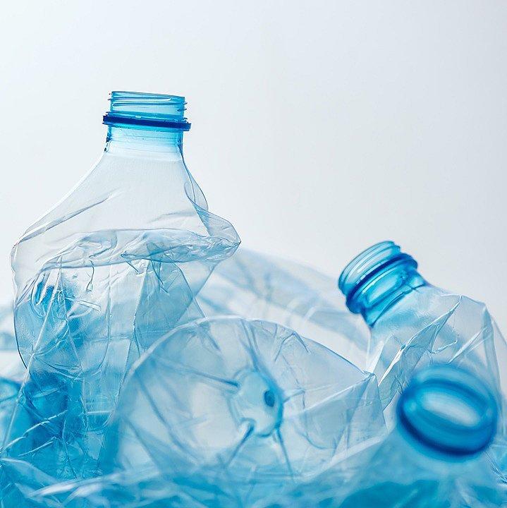 An image of empty, plastic water bottles represents prAna's use of recycled fibers. 